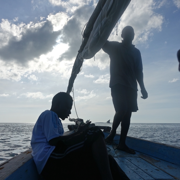 Sailing a dhow, off the coast of Zanzibar. 